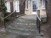 curved steel railing with bronze cap