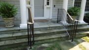 steel railing with bronze volute