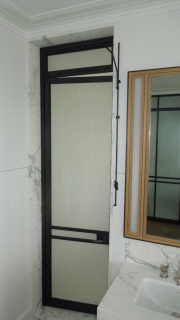 blackened and lacquered stainless shower door