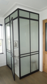 blackened and lacquered stainless toilet enclosure