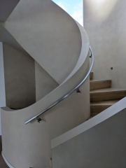 curved staircase to upper level